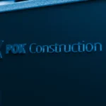 Text on a dark blue background reads POK Construction